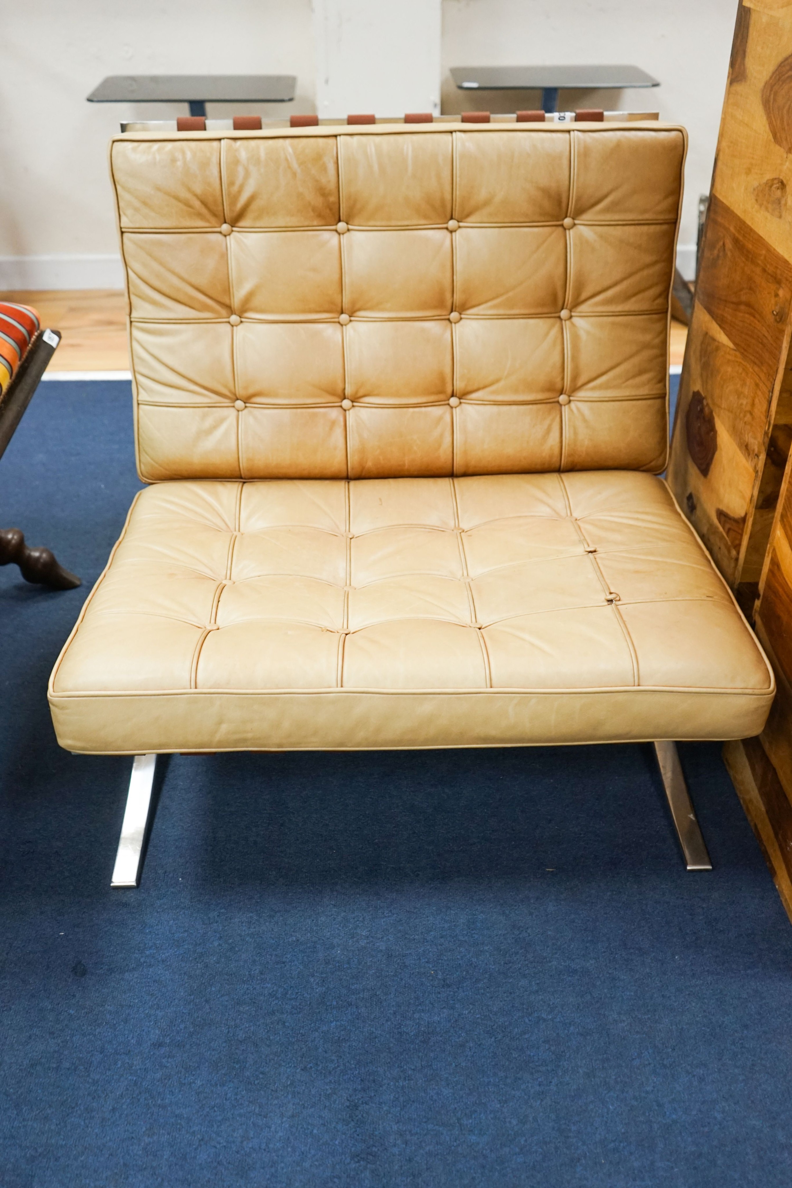 A brown leather and chrome Barcelona type chair, width 76cm, depth 70cm, height 74cm